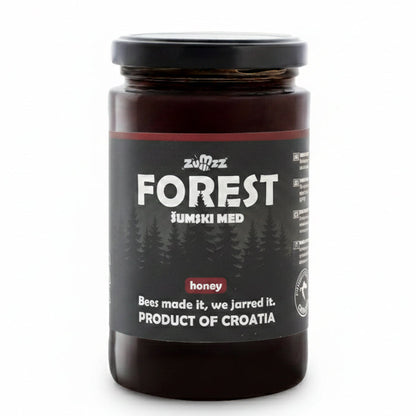 Jar of forest honey with a black label on a white background